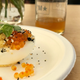 A deviled egg with smoked trout roe, everything spice, and purple shiso paired with Uinta Brewing’s Alpenglow wild ale.